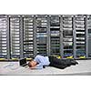 it business man in network server room have problems and looking for  disaster situation  solution