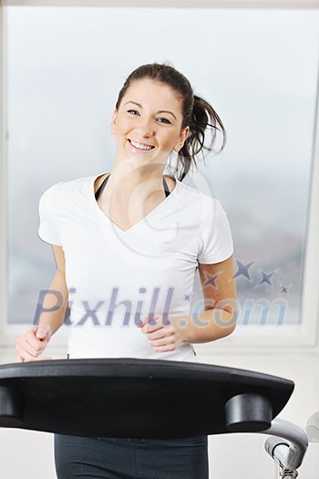 young woman exercise fitness and workout while run on track in sport club young woman exercise fitness and workout while run on track in sport club