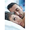 happy young healthy people  couple have good time in their bedroom make love and sleep
