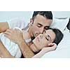 happy young healthy people  couple have good time in their bedroom make love and sleep