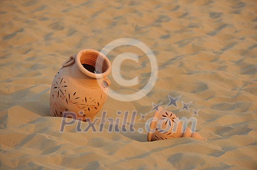 antique art old arabic pot in sand antique art old arabic pot in sand