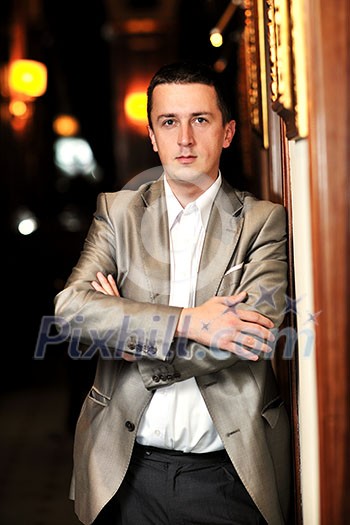 young business man portrait at night bar restaurant at conference seminar meeting