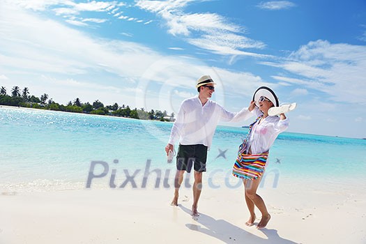 happy young romantic couple in love have fun running and relaxing on beautiful beach happy young romantic couple in love have fun running and relaxing on beautiful beach
