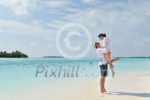 happy young romantic couple in love have fun running and relaxing on beautiful beach happy young romantic couple in love have fun running and relaxing on beautiful beach