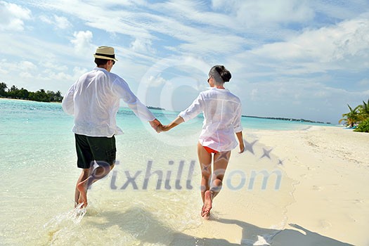 happy young romantic couple in love have fun running and relaxing on beautiful beach happy young romantic couple in love have fun running and relaxing on beautiful beach