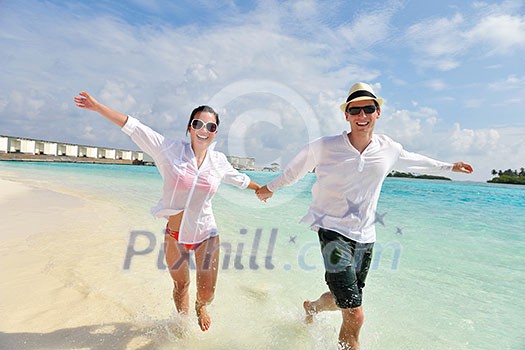 happy young romantic couple in love have fun running and relaxing on beautiful beach happy young romantic couple in love have fun running and relaxing on beautiful beach