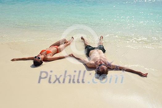 happy young romantic couple in love have fun running and relaxing on beautiful beach