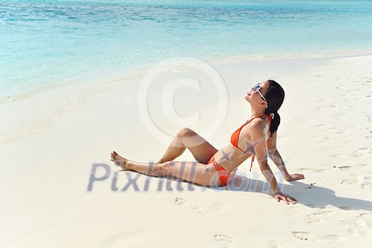 beautiful and happy woman girl on beach have fun and relax on summer vacation  over the sea