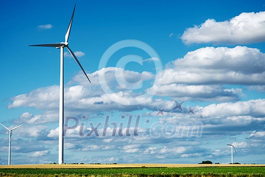 Wind generator turbines on summer landscape