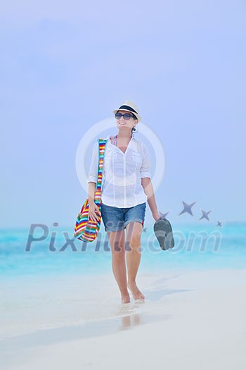 beautifel and happy woman girl on beach have fun and relax on summer vacation  over the beautiful tropical sea