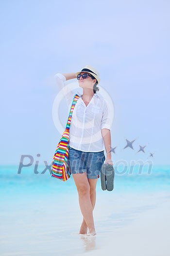 beautifel and happy woman girl on beach have fun and relax on summer vacation over the beautiful tropical sea beautifel and happy woman girl on beach have fun and relax on summer vacation over the beautiful tropical sea