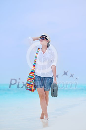 beautifel and happy woman girl on beach have fun and relax on summer vacation  over the beautiful tropical sea