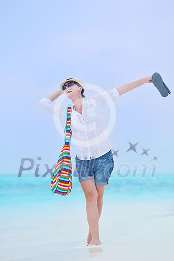 beautifel and happy woman girl on beach have fun and relax on summer vacation over the beautiful tropical sea beautifel and happy woman girl on beach have fun and relax on summer vacation over the beautiful tropical sea