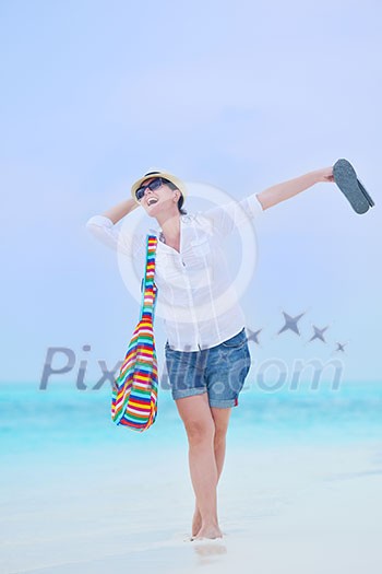 beautifel and happy woman girl on beach have fun and relax on summer vacation  over the beautiful tropical sea