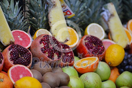 Colorful display of fruits background on traditional local market ready to made fresh juice drink Colorful display of fruits background on traditional local market ready to made fresh juice drink