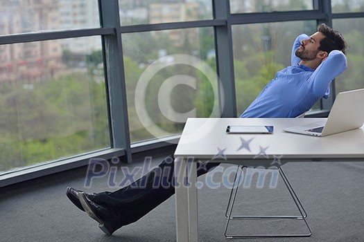 happy young business  man work in modern office on computer