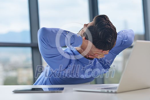 happy young business man work in modern office on computer happy young business man work in modern office on computer
