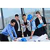 business people group on meeting and presentation  in bright modern office with construction engineer architect and worker looking building model and blueprint  plans