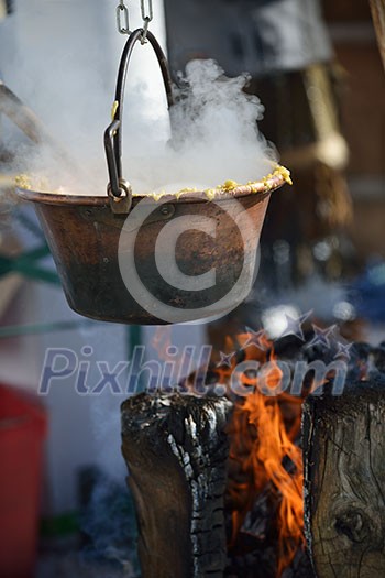 polenta food prepared on traditional recipe with fire and woods on height mountain alps at winter season at beautiful sunny day polenta food prepared on traditional recipe with fire and woods on height mountain alps at winter season at beautiful sunny day