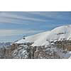 winter landscape with ski chairlift cabin and mountain covered with snow at sunny day