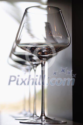 Empty very elegant wine glasses decorated on table