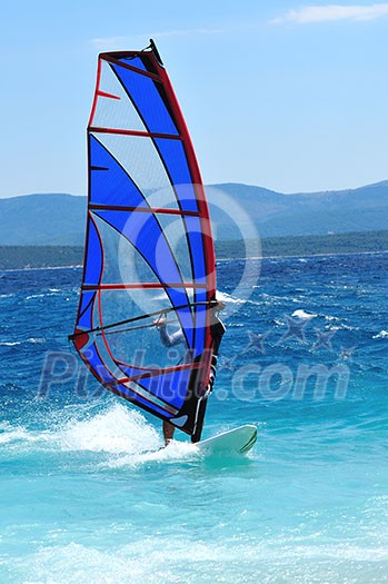 man wind sirfing and have healthy lifestyle man wind sirfing and have healthy lifestyle