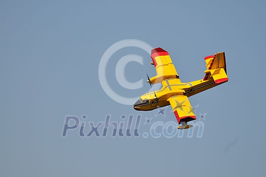 Airplane on sea taking water to drop over fire Airplane on sea taking water to drop over fire