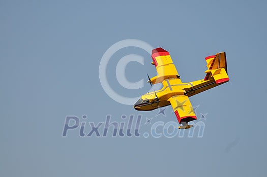 Airplane on sea taking water to drop over fire