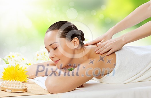 Image of young woman relaxing in spa salon