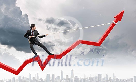 Image of businessman standing on graph and pulling it upwards