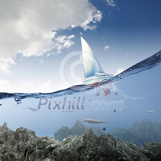 Floating yacht and dolphins swimming under water Floating yacht and dolphins swimming under water