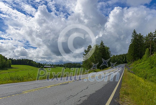 Country road after rain in agricultural environment