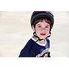 Portrait of a little boy rollerblading in a helmet