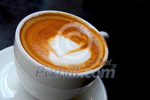 Cappuccino with heart shape on foam