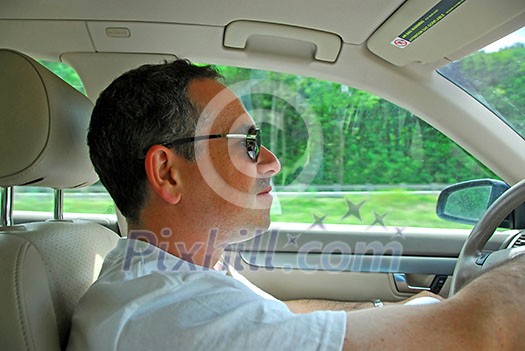 Man driving a car Man driving a car