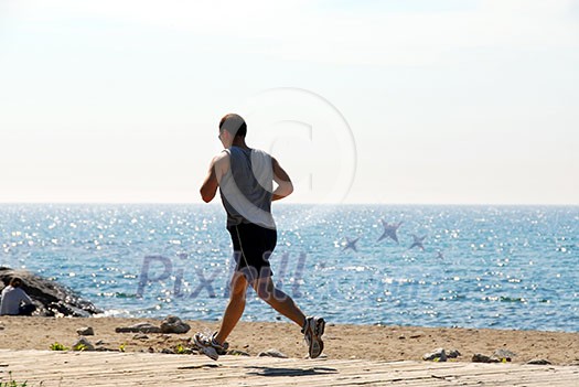 Man jogging in a beach