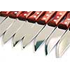 Steak knives in a row on white background