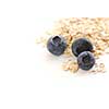 Blueberries and oats macro on white background