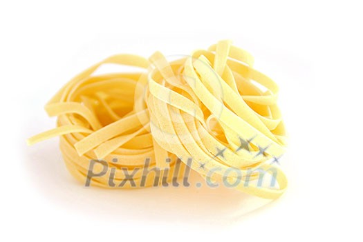 Fettuccini nests on white background Fettuccini nests on white background