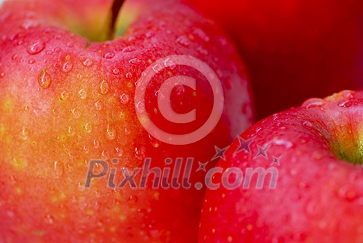 Macro of red apples with water droplets 