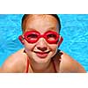 Portrait of a smiling girl in red goggles 