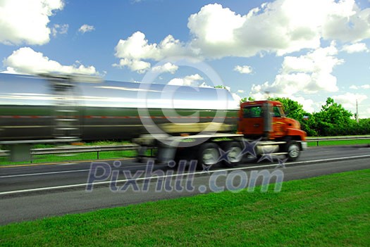Speeding truck delivering gasoline on highway Speeding truck delivering gasoline on highway
