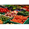 Fresh assorted vegetables in boxes on farmer's market