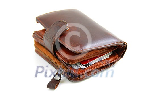 Old leather wallet full of credit cards on white background