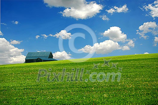 Barn in summer farm field,  deep blue sky