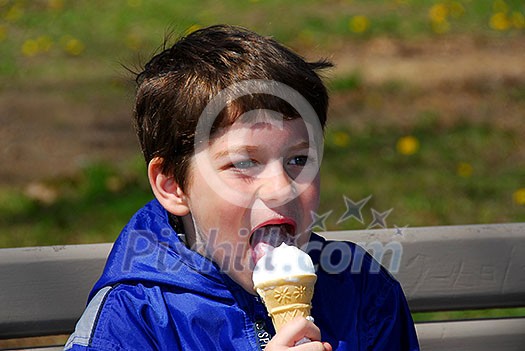 Little boy licking ice cream