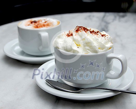 Two cups of specialty coffee on a table Two cups of specialty coffee on a table