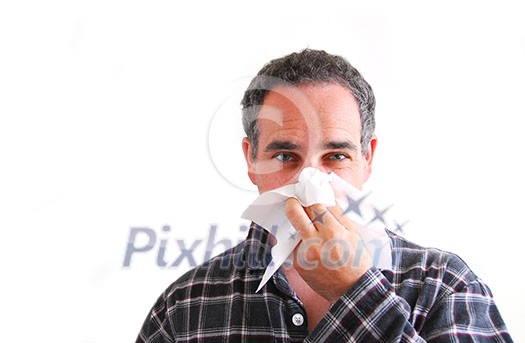 Man with a flu blowing his nose Man with a flu blowing his nose