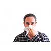 Man with a flu blowing his nose