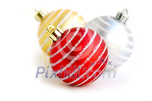 Three christmas glass balls on white background